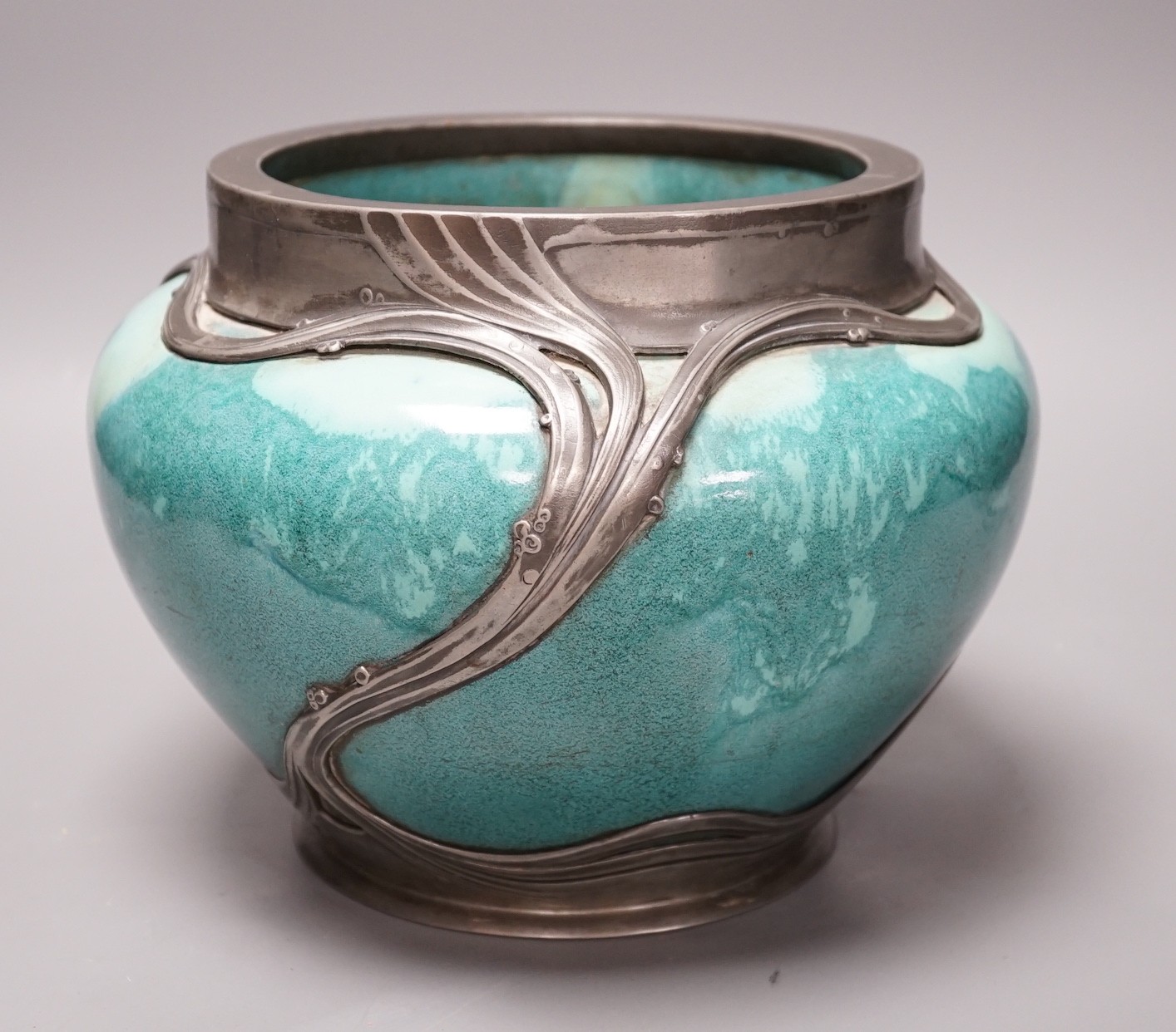 An Art Nouveau Orvit pewter mounted Ruskin style turquoise glazed jardiniere, 18cms high